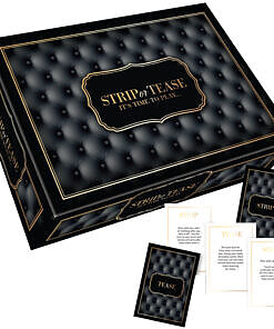 Strip or Tease Game box and contents including guidebook and suggestive dice on a dark