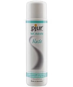 Pjur Woman Nude Waterbased Lube 100ml bottle with clear liquid and white label on a soft surface.