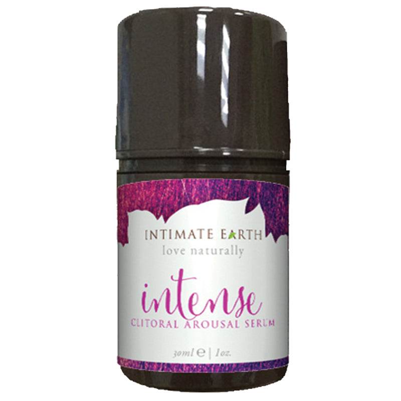 Intimate Earth Intense Clitoral Arousal Serum 1 oz bottle with pump top on a bedside table
