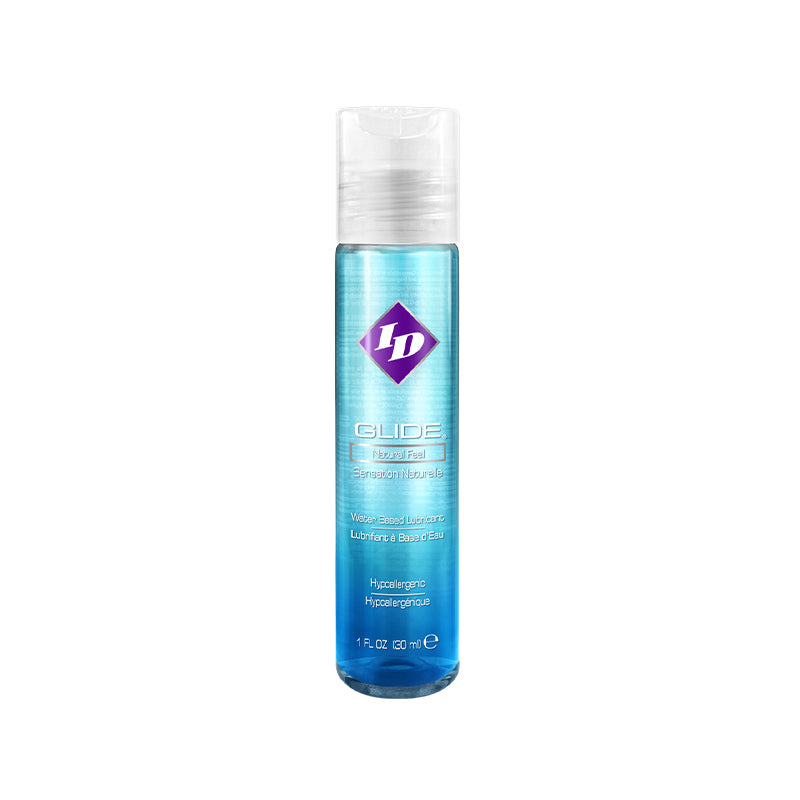 ID Glide lubricant 1 fl oz pocket bottle on a nightstand