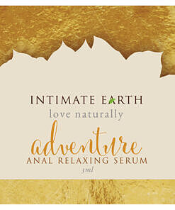 Intimate Earth Anal Relax spray foil on a wooden surface with organic botanical accents.