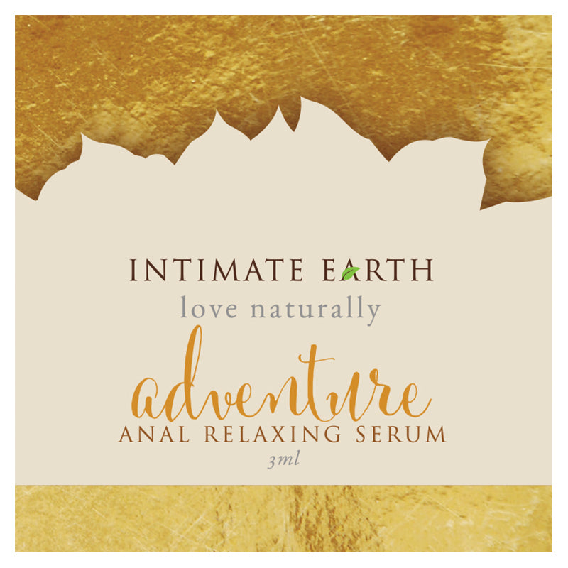 Intimate Earth Anal Relax spray foil on a wooden surface with organic botanical accents.
