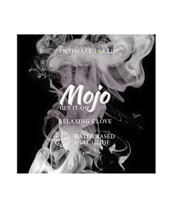 Mojo Water-Based Anal Relaxing Glide 3 ml foil pack showing product next to a sleek silicone toy on a moody bedside table.