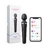Lovense Domi 2 Bluetooth wand vibrator in black with pink silicone head and touch controls on a white desk.
