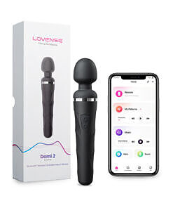 Lovense Domi 2 Bluetooth wand vibrator in black with pink silicone head and touch controls on a white desk.