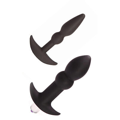 Tantus Perfect Plug Anal Plug Kit Onyx with two black silicone plugs and vibrating bullet on white background.
