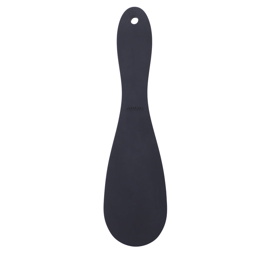 Black oval Tantus Pelt Paddle Onyx with smooth grip handle and hanging loop on a white surface.