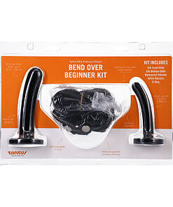 Tantus Bend Over Beginner Kit Onyx with two black silicone dildos and fabric harness laid flat on a dark background.