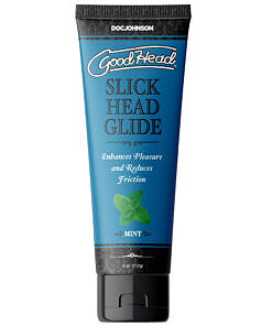 GoodHead Slick Head Glide Mint 4 oz. Bulk bottle next to a playful mint leaf on a soft gray background.