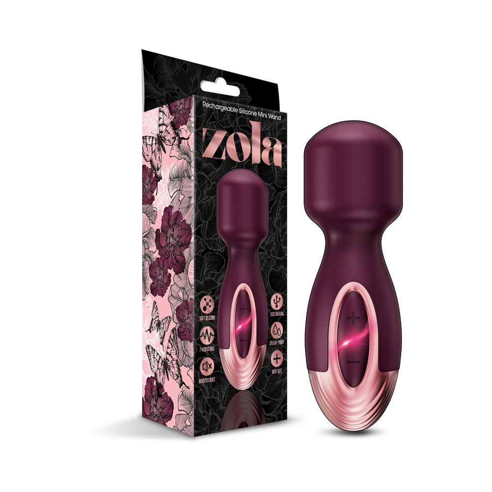 Black Zola rechargeable mini wand with flexible silicone head and USB cable on wooden nightstand.