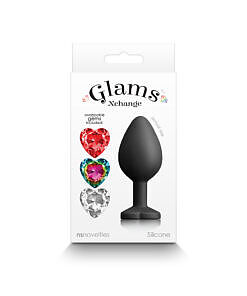 Heart anal plug medium with interchangeable gems displayed on a sleek surface showing three colorful jewels.