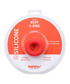 Crimson silicone Tantus Buoy C-Ring stretched over a white background