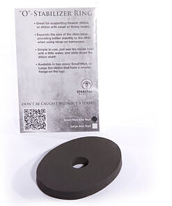 Black SpareParts Base Stabilizer placed under a dildo's base to show expanded stability on a harness strap