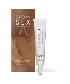 Bijoux Indiscrets Slow Sex Clitoral Balm jar with warming balm on fingertip