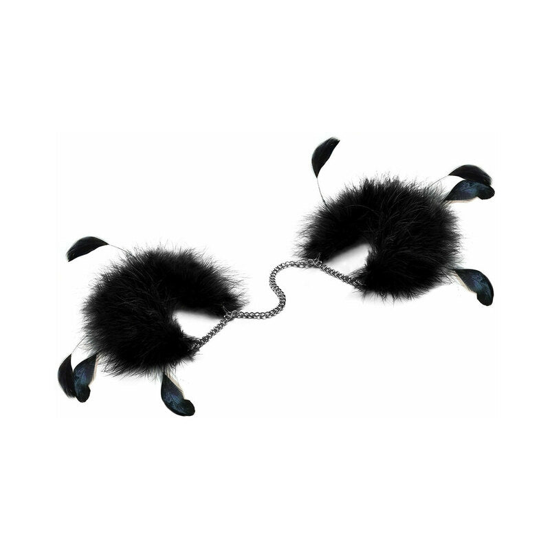 Close-up of Bijoux Indiscrets Za Za Zu Feather Cuffs with black and white marabou fluff and metal buckle gleaming.