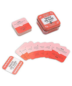 After Dinner Amusements Truth or Dare for Couples Game box with cards fanned out on a dinner table