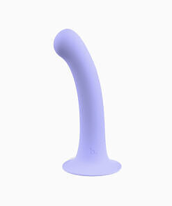 Biird Surii silicone dildo with suction cup lying on a glossy surface