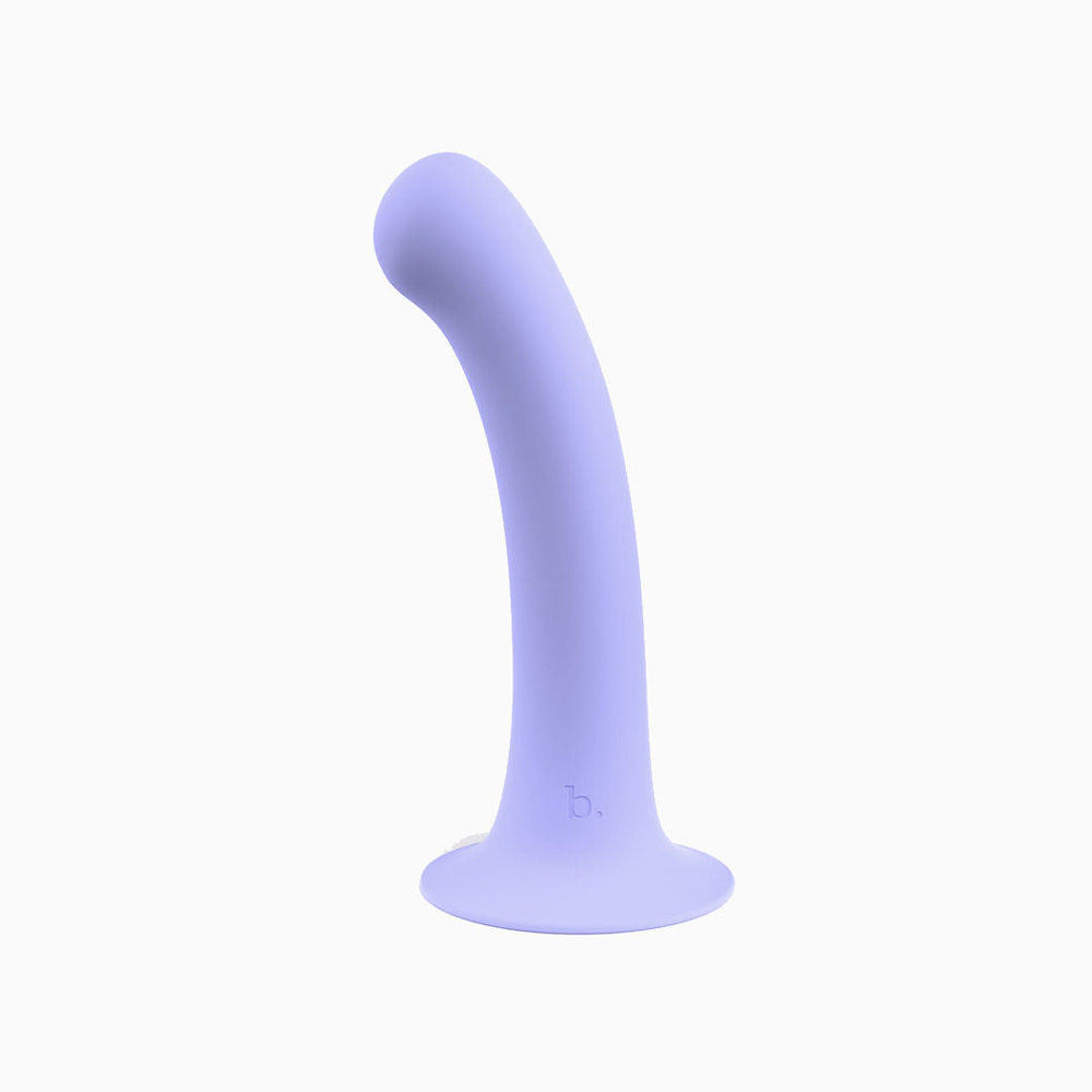 Biird Surii silicone dildo with suction cup lying on a glossy surface