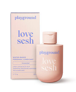 Playground Love Sesh clear water-based personal lubricant bottle with bamboo leaf graphic on a white countertop.