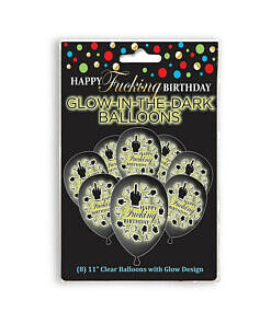 Happy Fucking Birthday Glow in the Dark Balloons 8-Pack arranged in a dark room glowing green with the cheeky message visible
