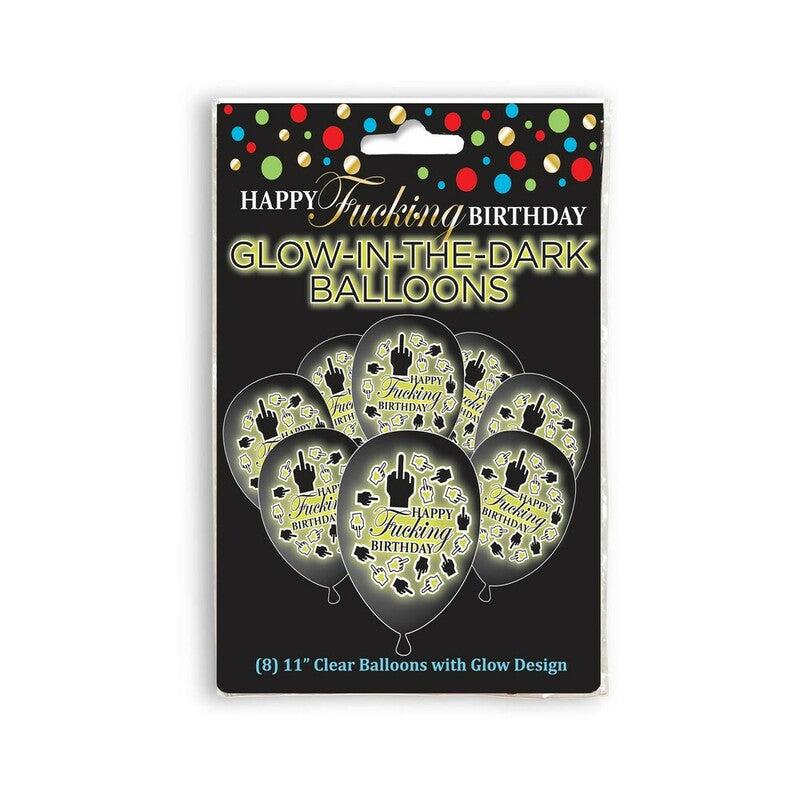 Happy Fucking Birthday Glow in the Dark Balloons 8-Pack arranged in a dark room glowing green with the cheeky message visible