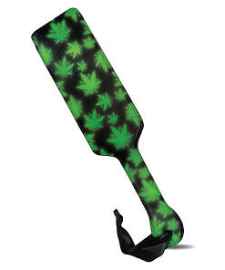 lime green cannabis leaf pattern glowing on a black surface.