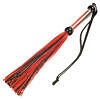 Black silicone flogger with slender tails and wrist strap displayed on a white surface.