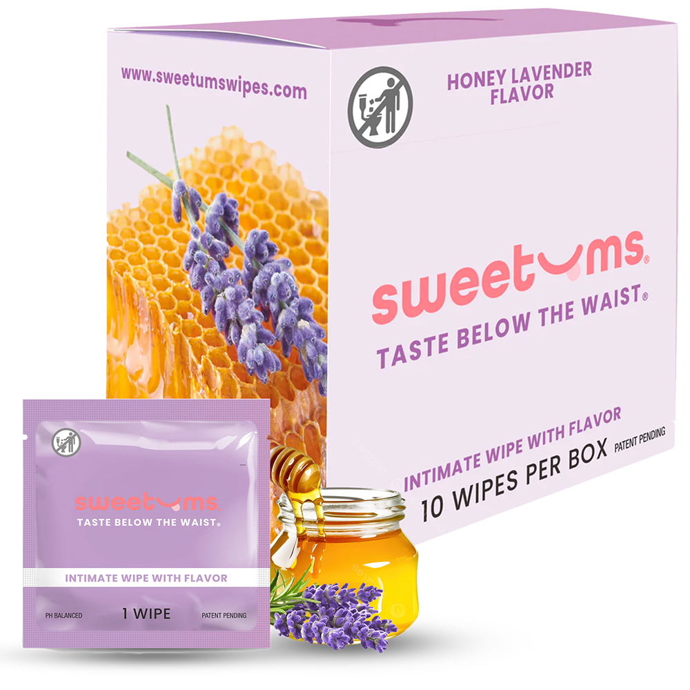 Sweetums Intimate Wipes Honey Lavender 10-pack on a bedside table with soft candlelight