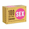 100 Questions About Sex card deck fanned out on a duvet