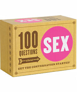100 Questions About Sex card deck fanned out on a duvet