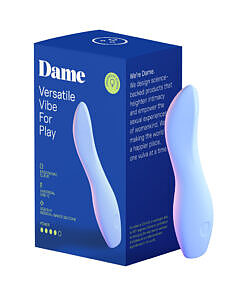 Dame Dip 2.0 Classic Vibrator in periwinkle blue sitting next to its magnetic USB-C charger on a white background.