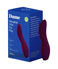 Sleek plum-colored Dame Dip 2.0 Classic Vibrator held in hand against a white background