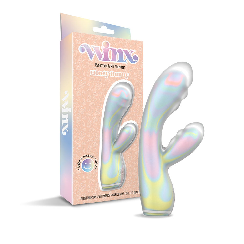 Pastel rainbow swirl WINX Honey Bunny Squishy Silicone Vibrator on a bathroom shelf
