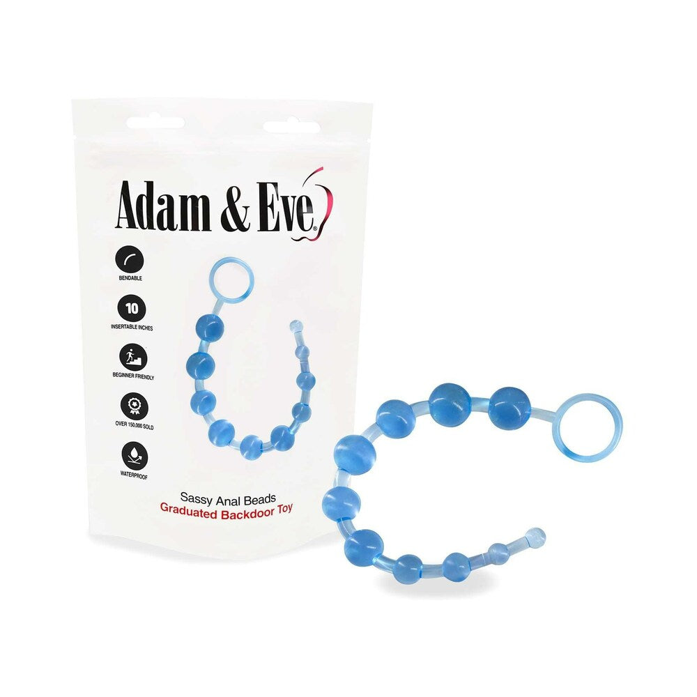 Clear flexible Sassy anal beads string with graduated sizes from 0.25 to 1 inch on a white desk near a storage bag.