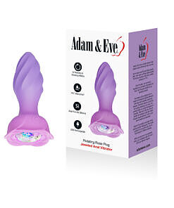 Rotating rose plug in red silicone with tapered swirl-textured tip and flower-shaped base on a white surface.