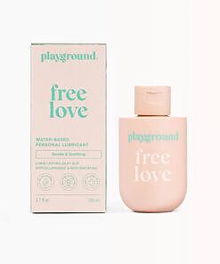 Playground Free Love Extra-Gentle Water-Based Personal Lubricant 3.7 oz tube on a clean bathroom shelf