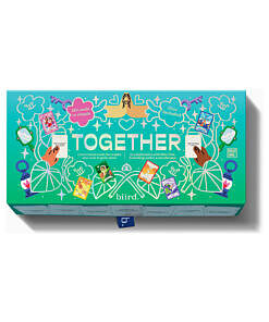 Biird x Jouissance Club Together couples card game box with 180 psychology-backed cards resting on a plush duvet