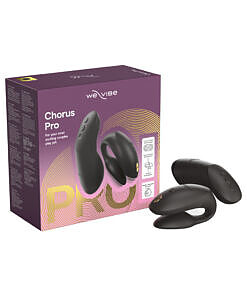 We-Vibe Chorus Pro in satin black silicone curved for dual stimulation beside its haptic squeeze remote and charging cable.