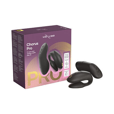 We-Vibe Chorus Pro in satin black silicone curved for dual stimulation beside its haptic squeeze remote and charging cable.