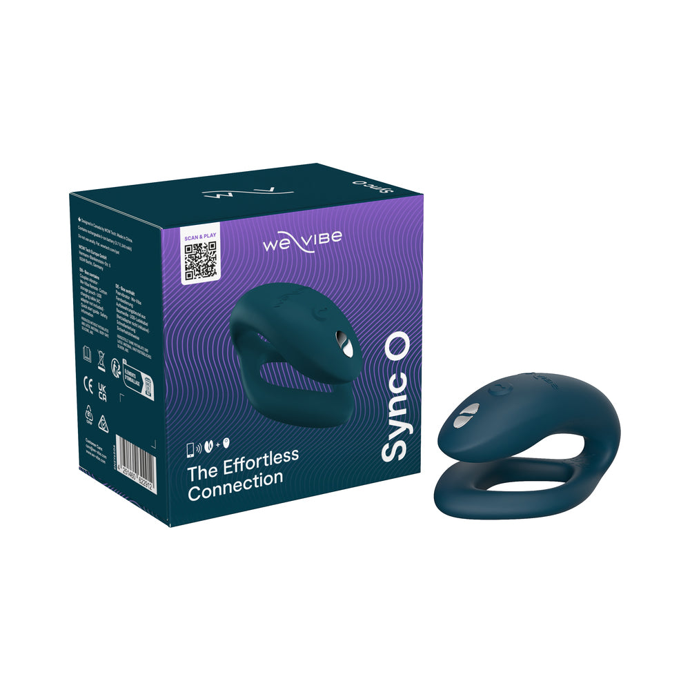 We-Vibe Sync O Rechargeable Remote Control Couples Vibrator Velvet Green shown with remote and charging base on a soft grey surface.