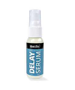Adam & Eve Marathon Delay Spray bottle on a dark bedside table
