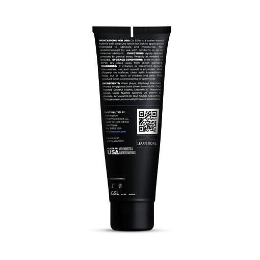 creamy white lotion droplet on a sleek dark surface.