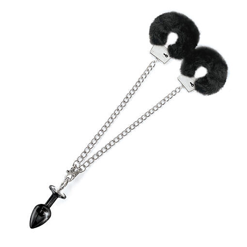 showing shiny jewel plug and plush fur cuffs on white backdrop.