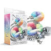 NIXIE metal butt plug handcuff set with sparkling rainbow jewel plug and faux-fur cuffs on satin sheet.