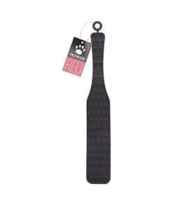 Prowler RED Silicone Paddle held at angle showing vibrant red silicone striking surface and textured ergonomic handle against dark background.