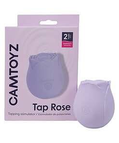 Camtoyz Tap Rose Pulsation Stimulator in soft pink silicone held against a delicate rose petal background.