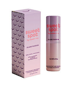 Sweetums Sweet Spot Flavored Fragrance Island Passion 2 fl oz spray bottle beside sliced mango and passionfruit on a bamboo backdrop.