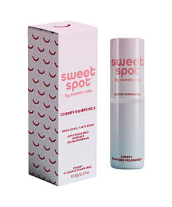 Sweetums Sweet Spot Flavored Fragrance Golden Vanilla spray bottle with vanilla bean and golden liquid on a soft background.