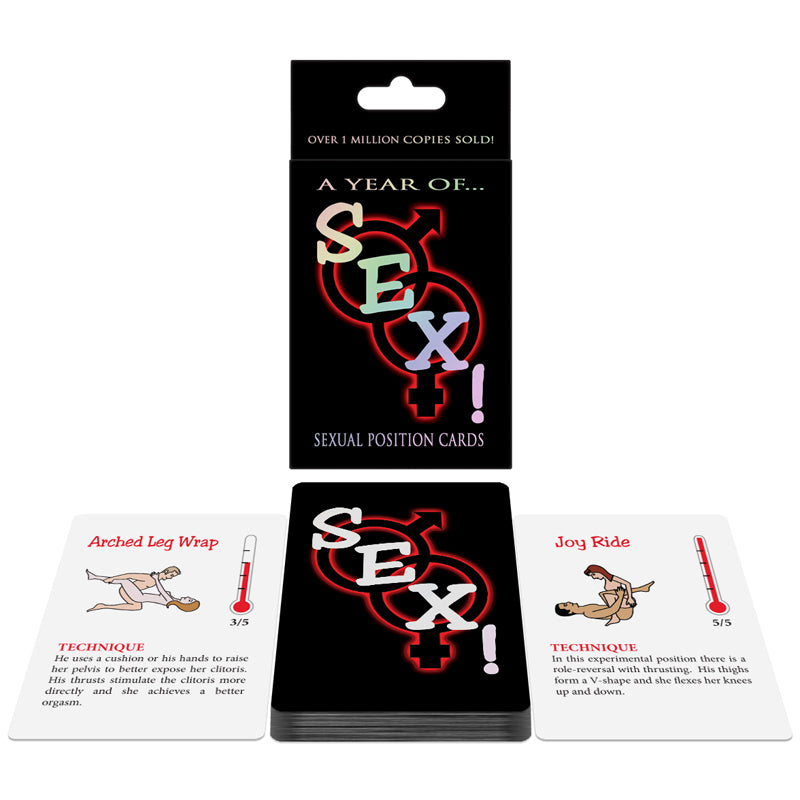 Sex Card Game deck with romantic prompts scattered on a satin sheet next to two glasses of wine and dim candlelight.