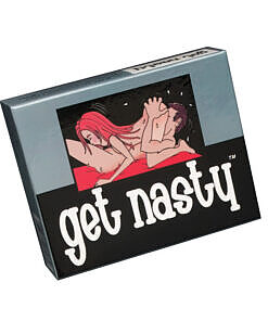 Get Nasty game components arranged on a bedroom setting with rose petals and dim lighting.